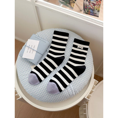 Top view of Rufia crew socks highlighting ribbed fabric and stripes