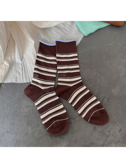 Model wearing Rufia Classic Fine Stripe Crew Socks with casual shoes
