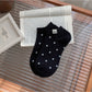 Rufia Everyday Polka Dot Socks displayed with packaging showing brand label
