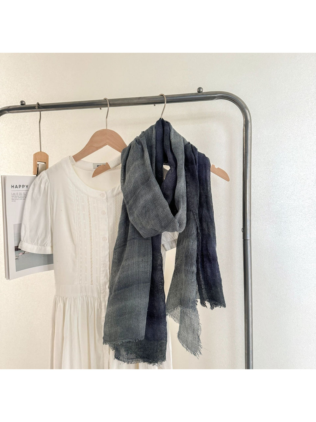 Scarvii scarf folded neatly highlighting soft material and fringe ends