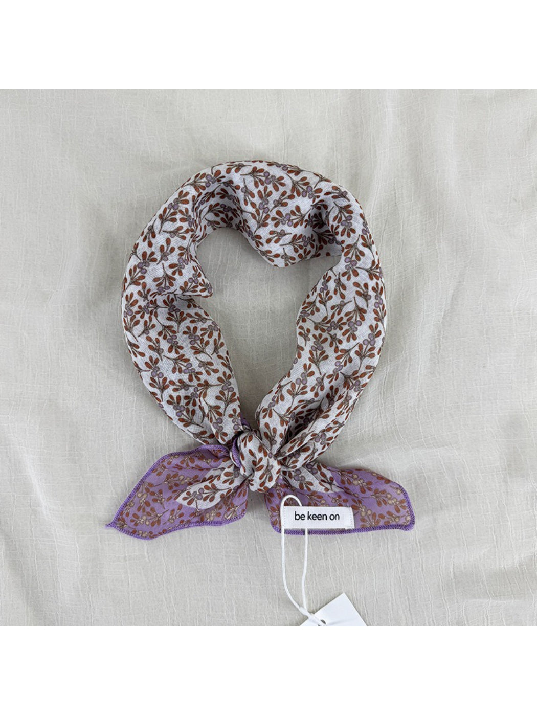 Scarvii Ditsy Floral Border Square Scarf folded showing floral border design on light background