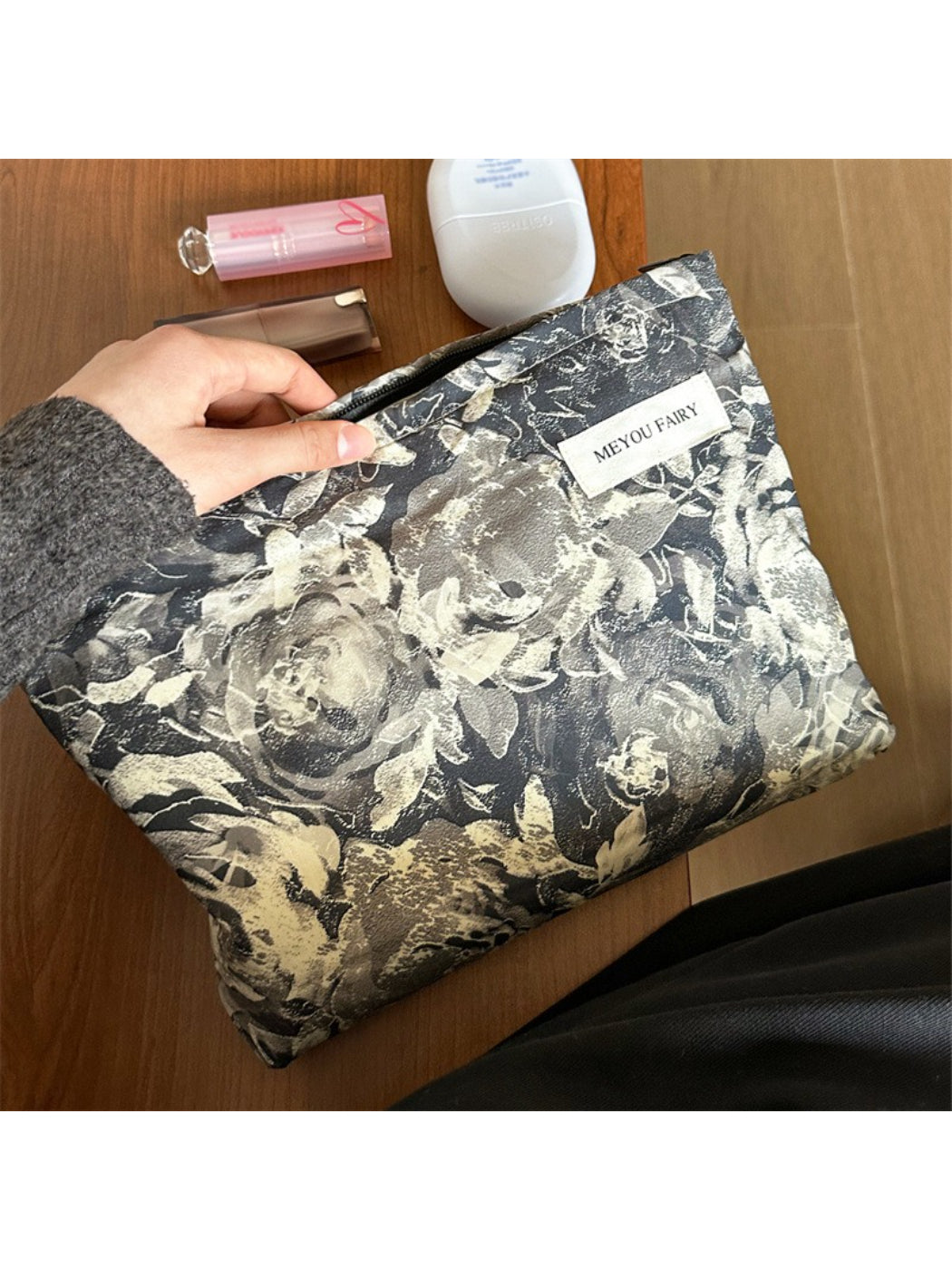 Cosbai floral makeup bag open showing spacious interior with cosmetics inside