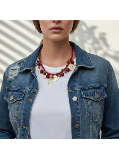 Neckit beaded necklace featuring floral charms laid flat on a white background