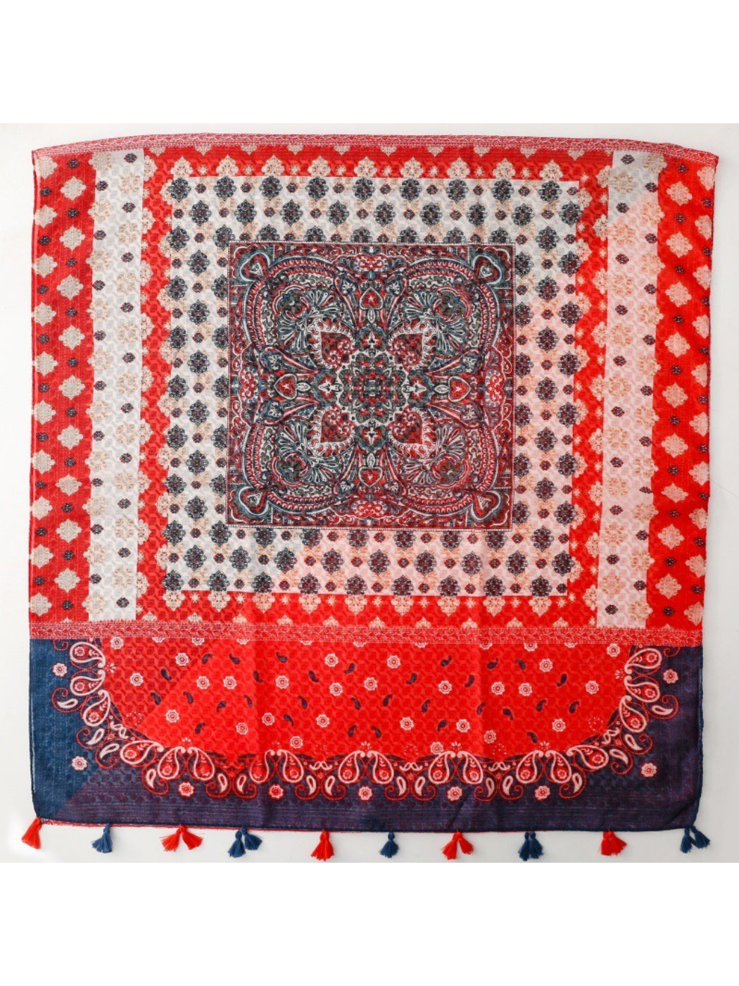 Red boho border scarf draped over shoulders showcasing full pattern and fringe edges