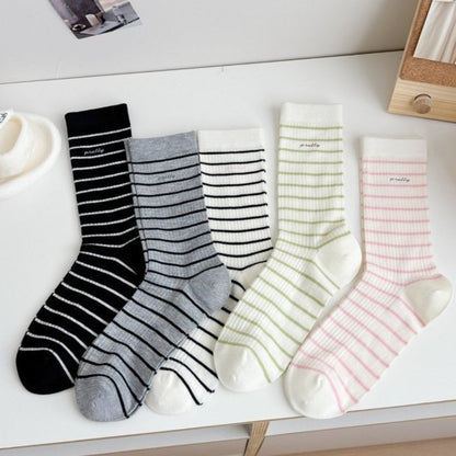 Pair of Rufia Pretty Fine Stripe Crew Socks worn on feet with casual shoes
