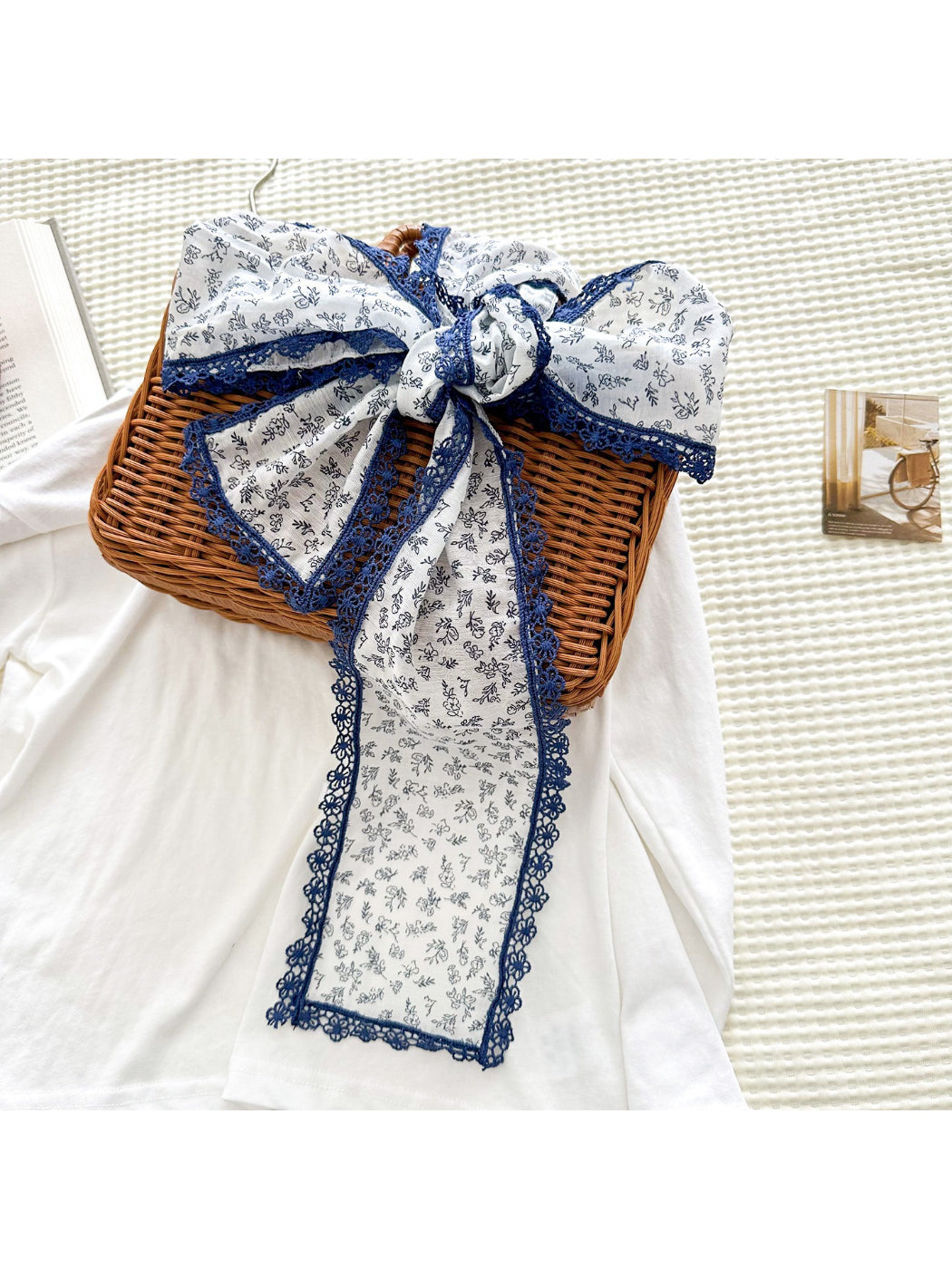 Scarvii floral skinny scarf styled around a neck with lace edges visible