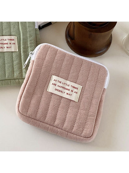 Cosbai cartoon print mini storage pouch placed on wooden surface for display
