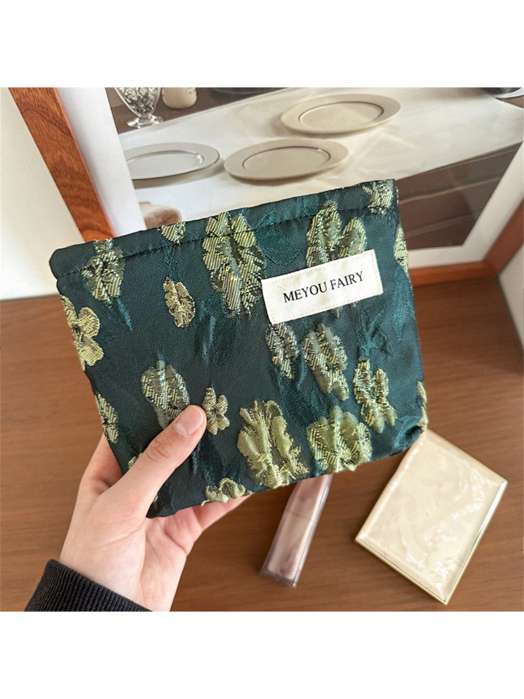 Top view of Cosbai floral makeup pouch partially open