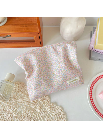 Cosbai Ditsy Floral Cosmetic Pouch held in hand to show size and scale