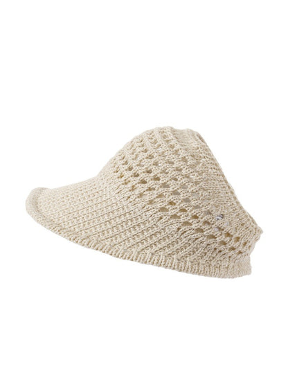 Model wearing Haila open knit wide brim sun hat outdoors with casual outfit