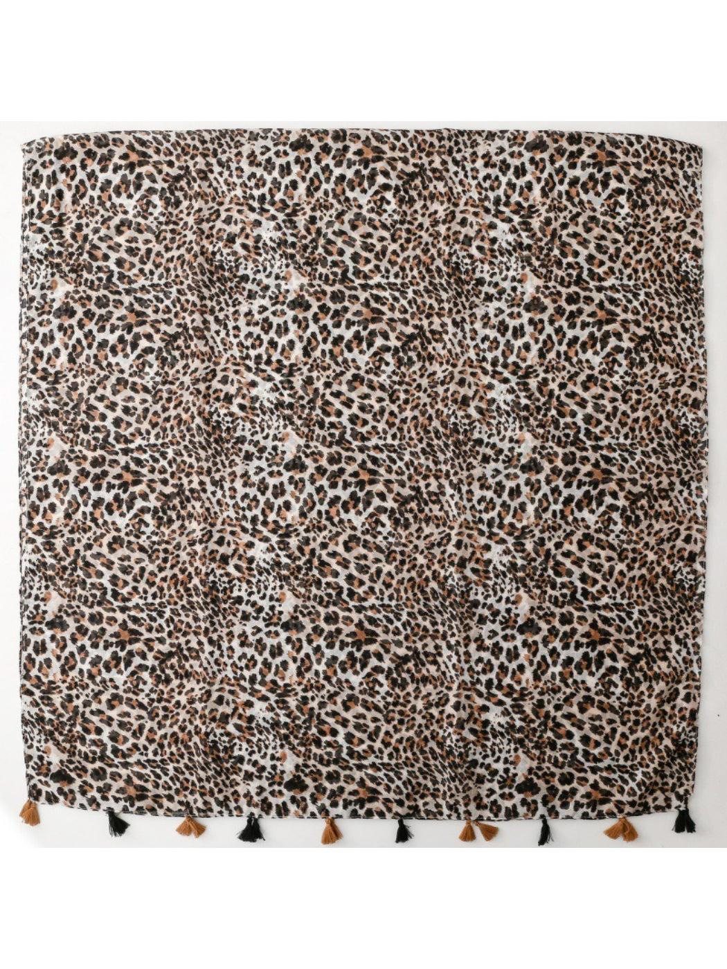 Model wearing the leopard print scarf draped around the neck