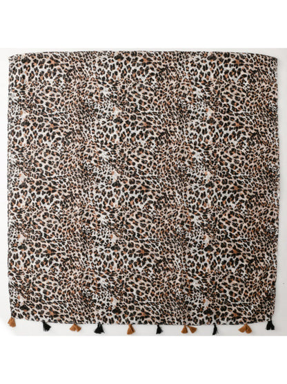 Model wearing the leopard print scarf draped around the neck