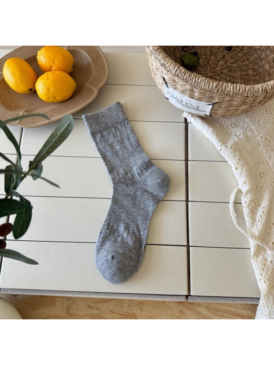 Rufia Dot Floral mid-calf socks in a single sock view showing full length