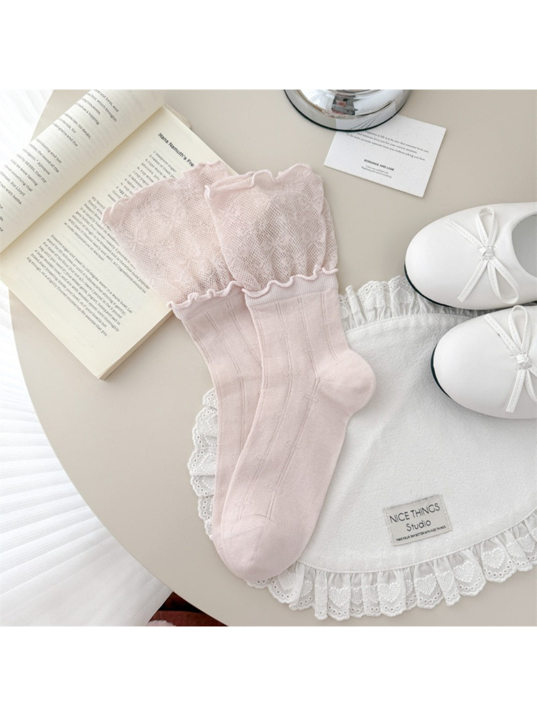Rufia lace crew socks displayed with folded cuff and scalloped trim