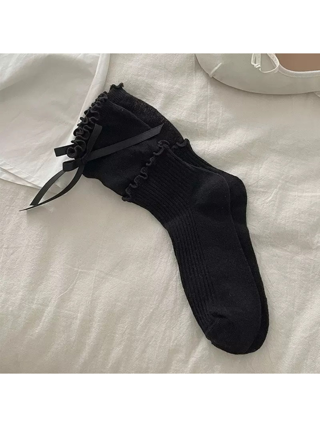 Rufia Ribbon Ruffle Crew Socks styled with casual footwear highlighting ruffle trim