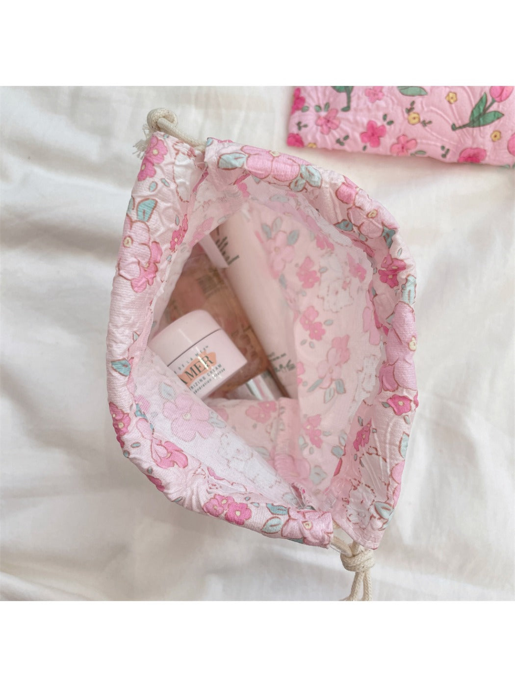 Cosbai cartoon drawstring pouch displayed upright with drawstrings hanging down
