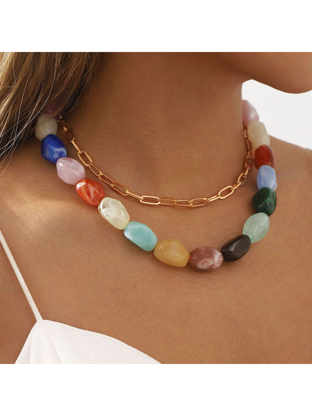 Close-up of colorful beaded chain necklace with small round beads