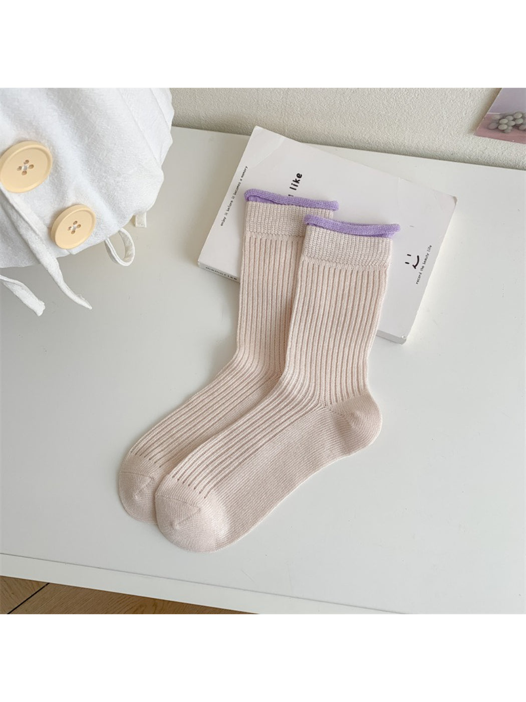 Close-up of fabric texture on Rufia ribbed crew socks with pastel contrast trim