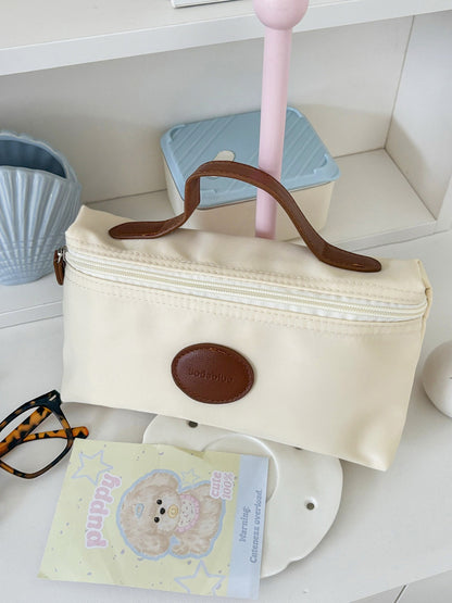 Cosbai beauty pouch standing upright on white surface