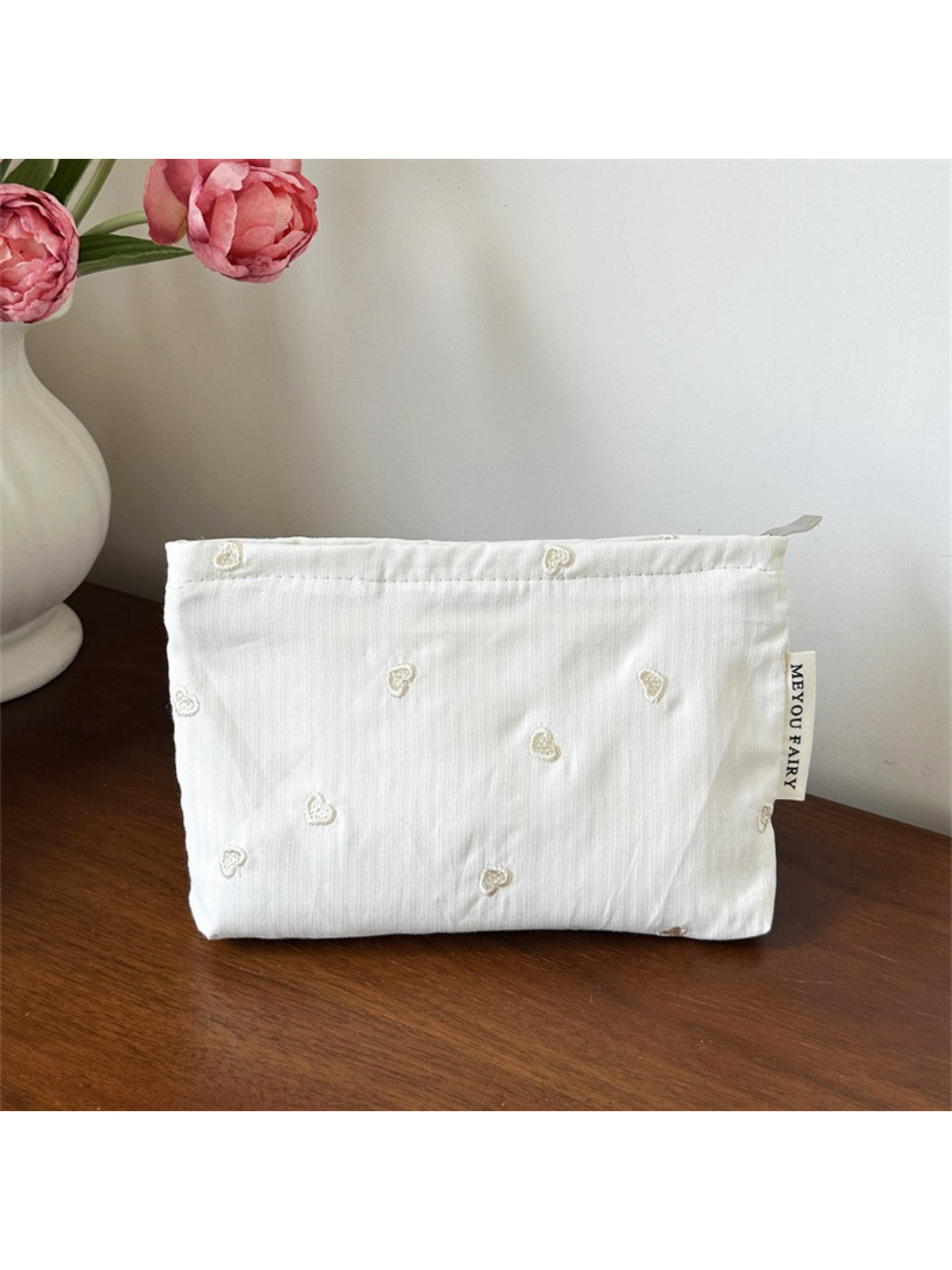Cosbai makeup organizer bag showing interior mesh pockets and elastic holders