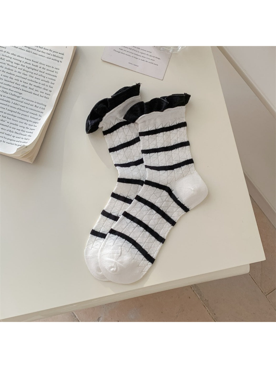 Model wearing Rufia summer crew socks with stripe and frill cuff paired with casual shoes