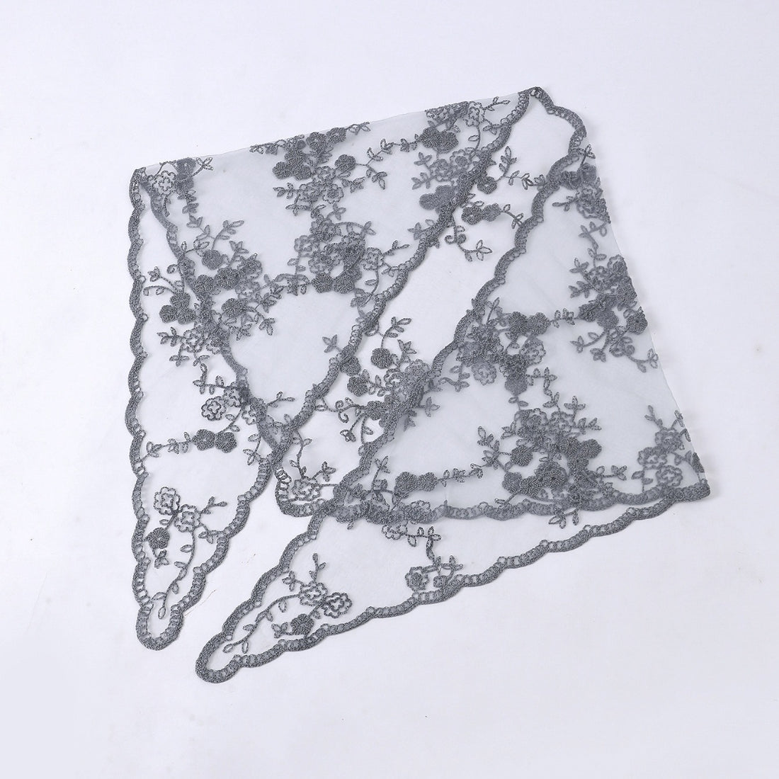 Side view of model with Haila floral lace veil head scarf draped elegantly