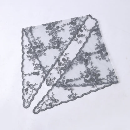 Side view of model with Haila floral lace veil head scarf draped elegantly
