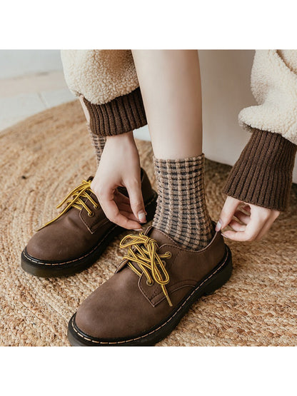 Close-up of Rufia textured check pattern on knit crew socks
