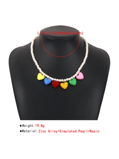 Side view of Neckit colourful heart charm necklace showing chain details