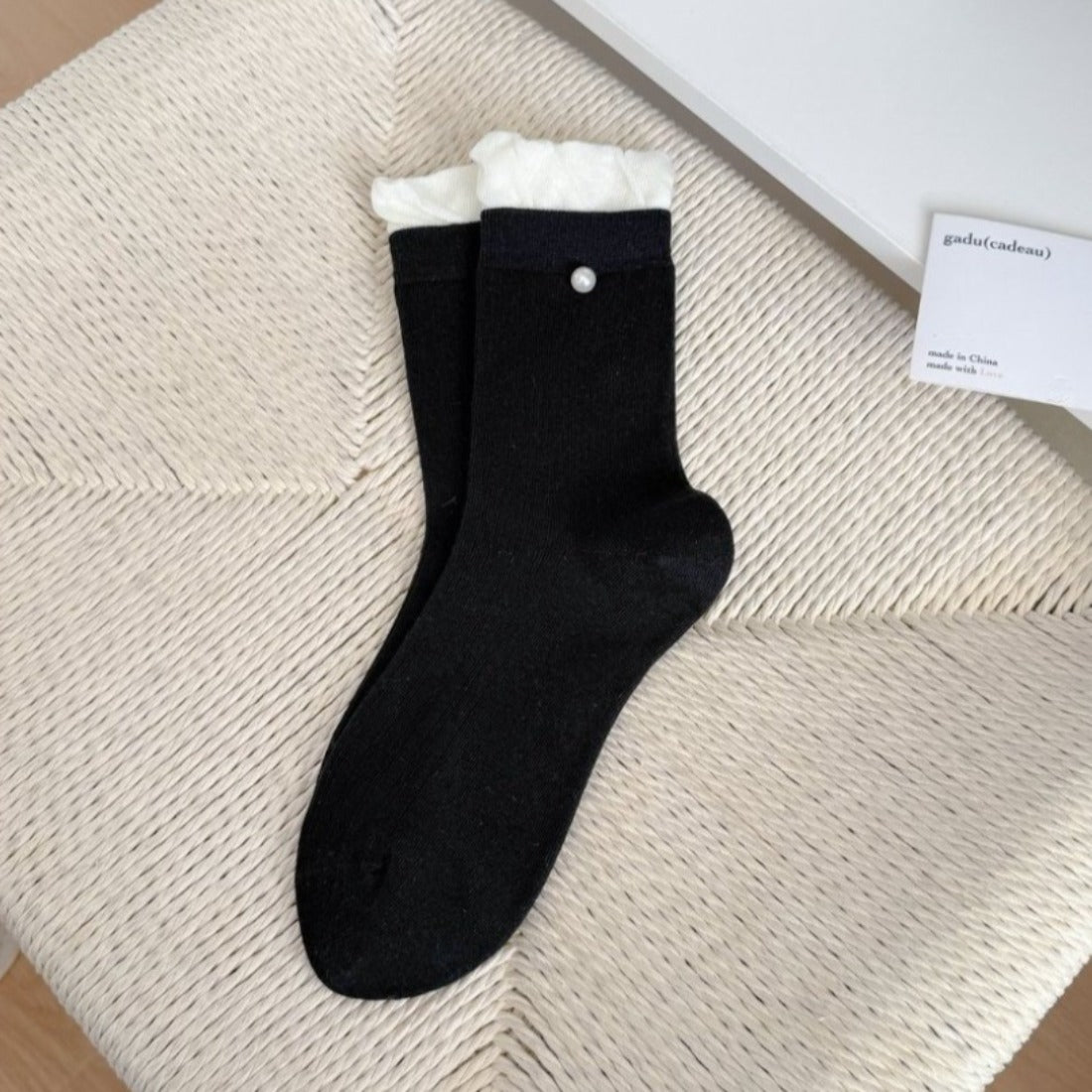 Model wearing Rufia ribbed ruffle accent crew socks with casual shoes