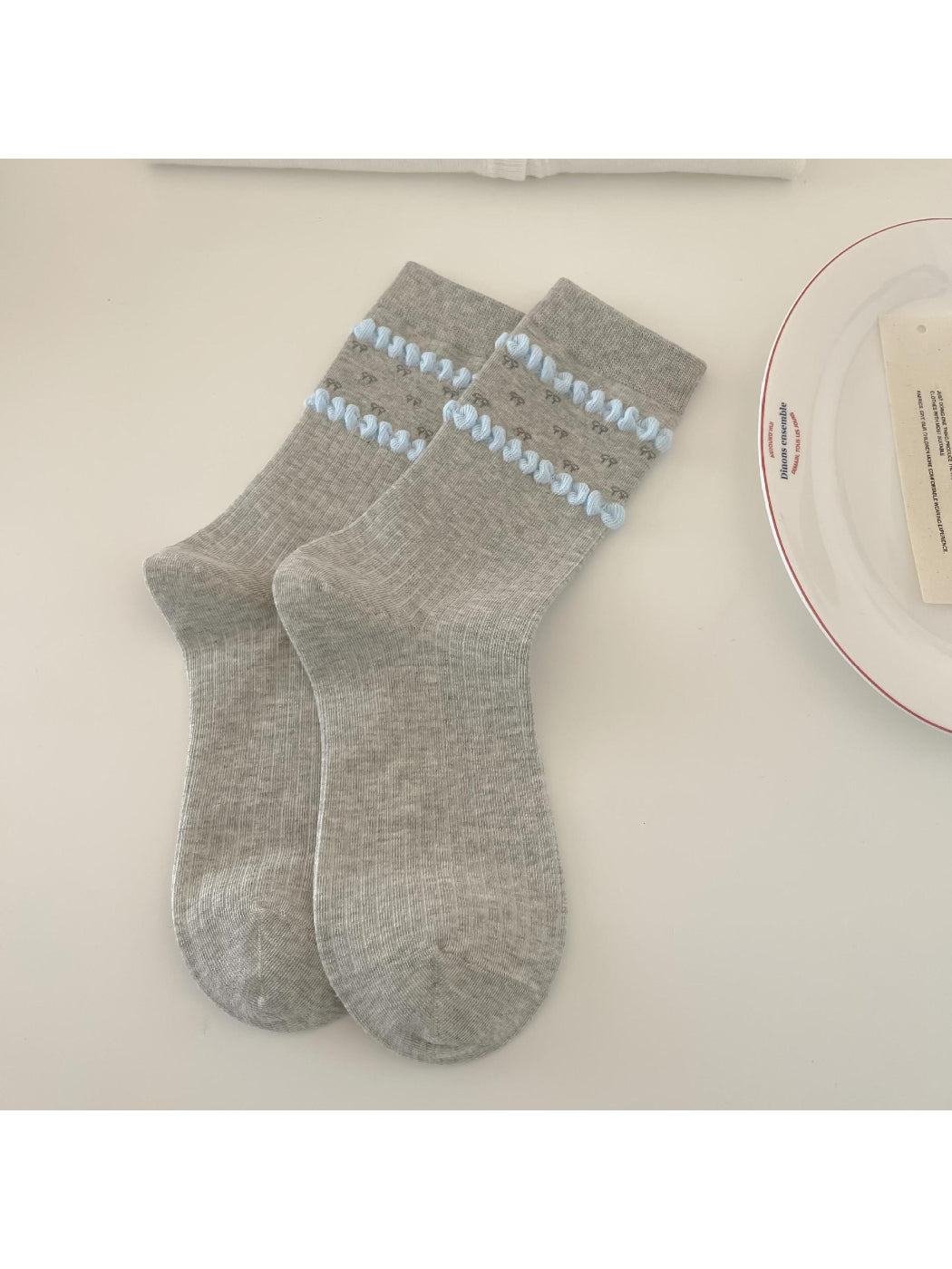 Rufia Dreamy Blue Trim Mixed Crew Socks folded with visible blue trim and mixed colors