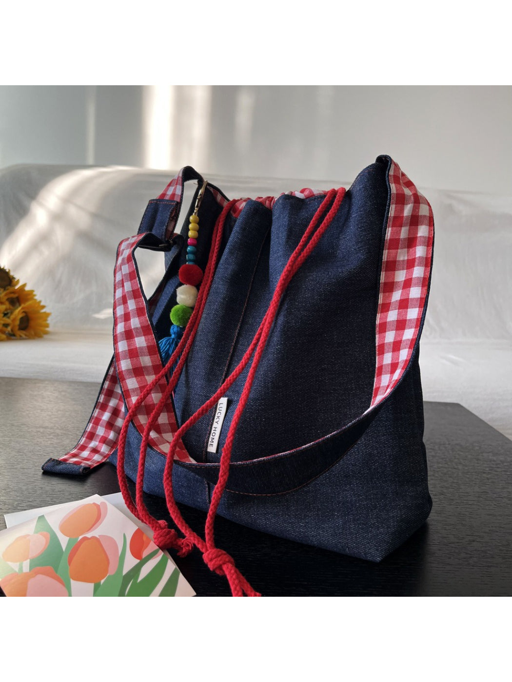 Cosbai bucket bag placed on wooden surface showing texture and design