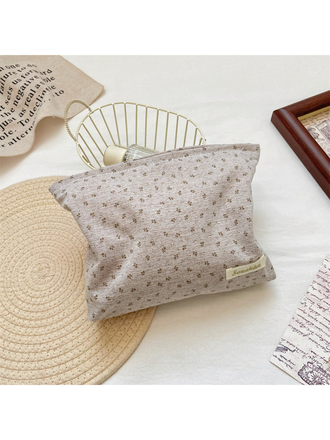 Side view of Cosbai vintage tiny flower cosmetic pouch highlighting its compact size