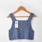 Close-up of hem and crochet texture on Crosa vintage camisole tank top