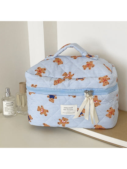 Close-up of quilted teddy pattern fabric on Cosbai beauty storage bag