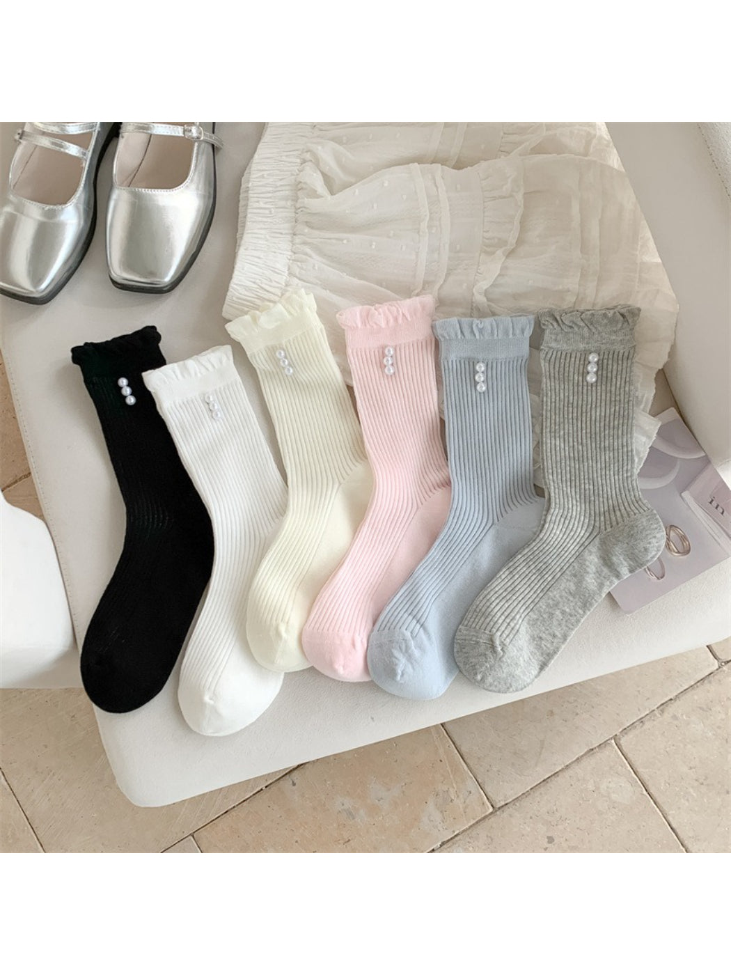 Pair of Rufia soft rib crew socks in light beige with delicate trim detail