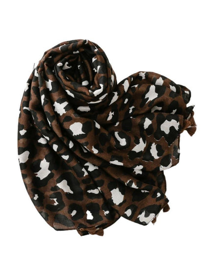 Brown leopard print scarf folded with fringed ends visible