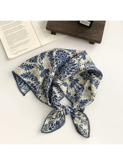 Scarvii square scarf laid flat displaying full ornate botanical design with symmetrical layout