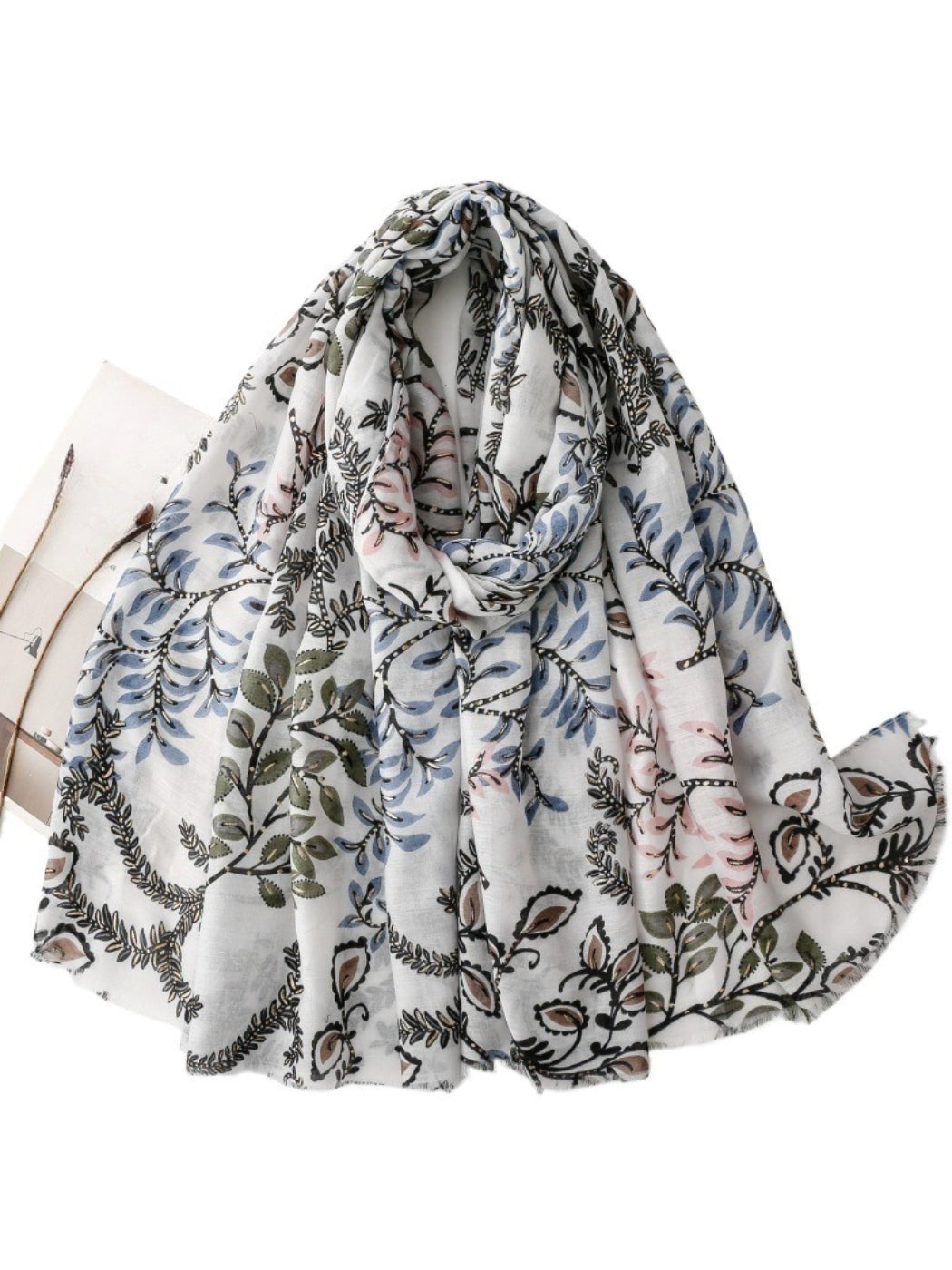 Scarvii Botanical Vine lightweight scarf folded showing green vine pattern on cream background