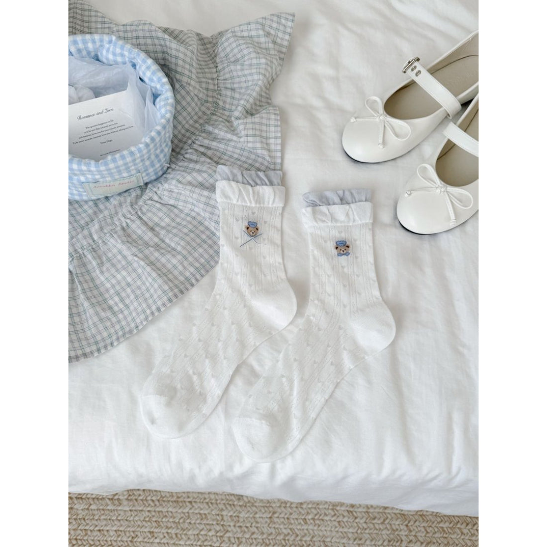 Rufia Bear Embroidered Ribbon Crew Socks folded to show embroidered bear and ribbon accents