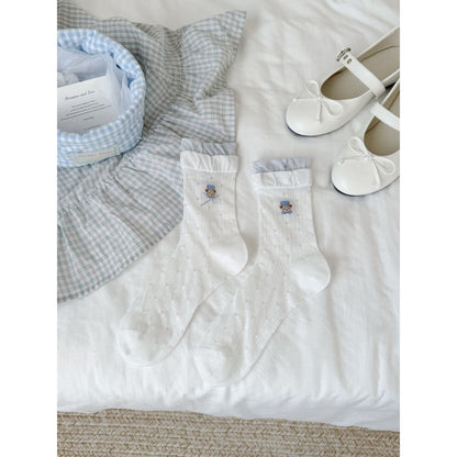 Rufia Bear Embroidered Ribbon Crew Socks folded to show embroidered bear and ribbon accents