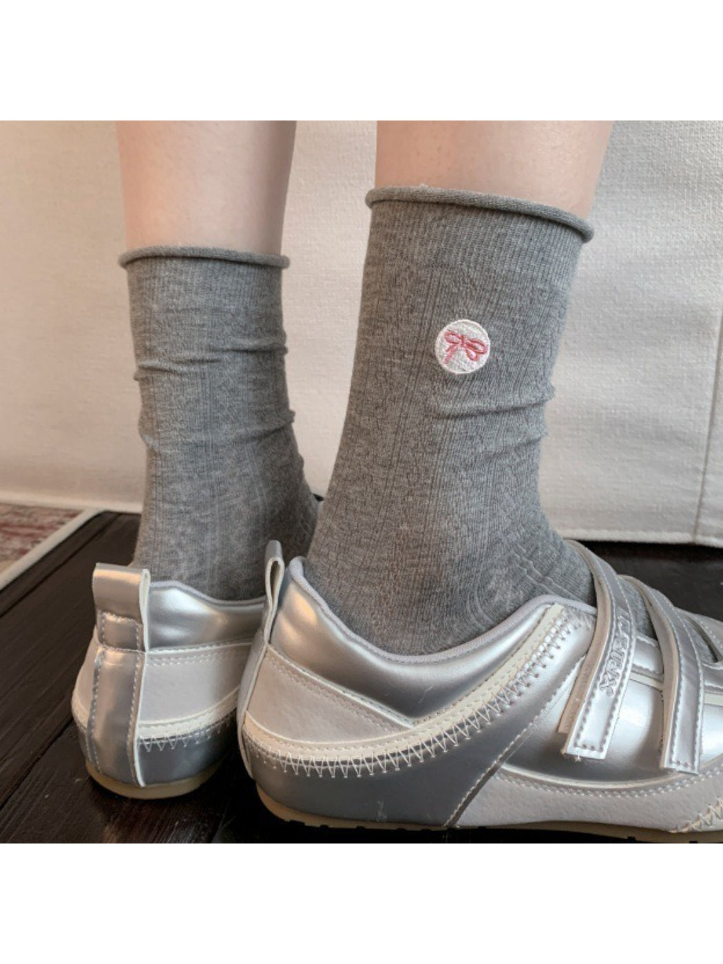 Side view of Rufia casual bow knit socks highlighting ribbed cuff and bow