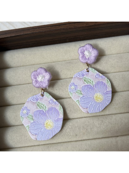 Side view of Earwish Purple Bloom Drop Earrings highlighting the drop length and flower detail