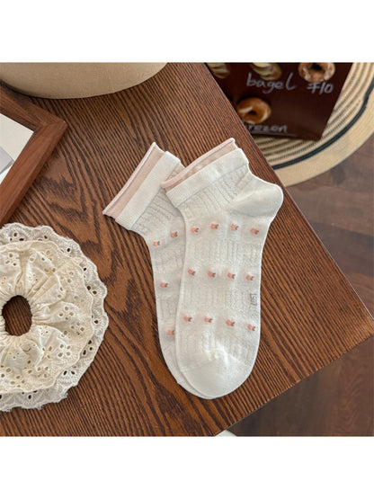 Side view of Rufia flower low cut socks showing soft fabric texture