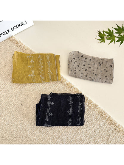 Close-up of Scarvii lightweight textured tie head scarf fabric and texture