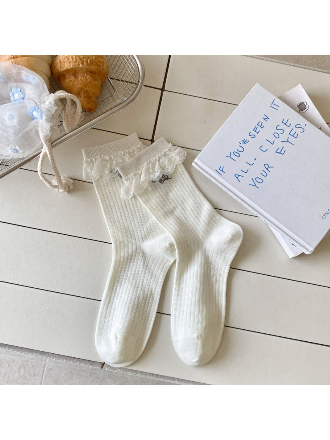 Side view of Rufia Sweet Blue Grey crew socks highlighting heel and toe design
