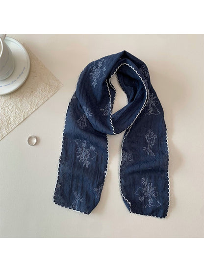 Scarvii Floral Stitch Narrow Scarf folded showing floral embroidery on light fabric