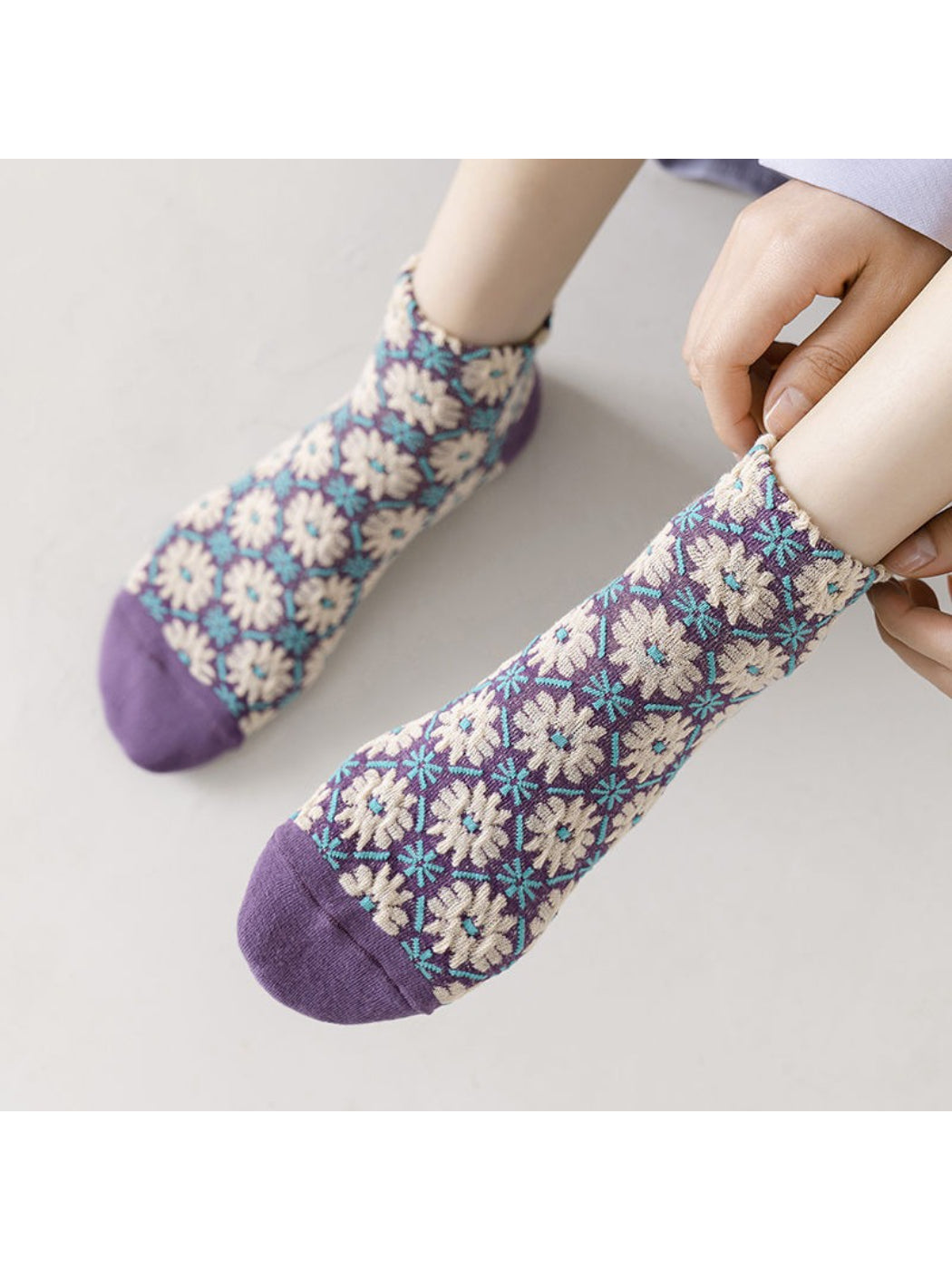 Close-up of Rufia soft knit ankle sock showing detailed flower embroidery