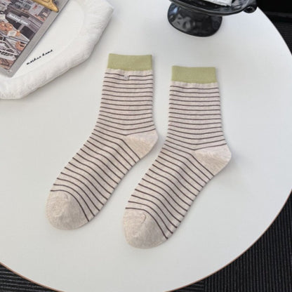 Rufia socks displayed on a wooden surface showing soft fabric texture