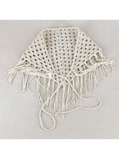 Close-up of intricate crochet pattern and tassel details on the bandana